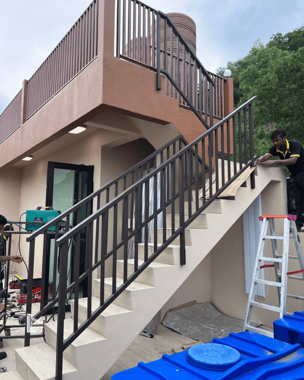 Custom interior stair railing with vertical balusters and a smooth handrail