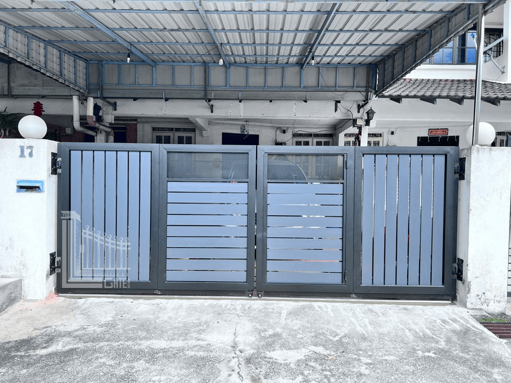 Powder-coated folding gate with mixed slat panels at a terrace house in Ipoh, Perak